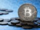 Bitcoin a atins 77.000 de dolari și a declanșat lichidări de peste un miliard de dolari într-o singură zi